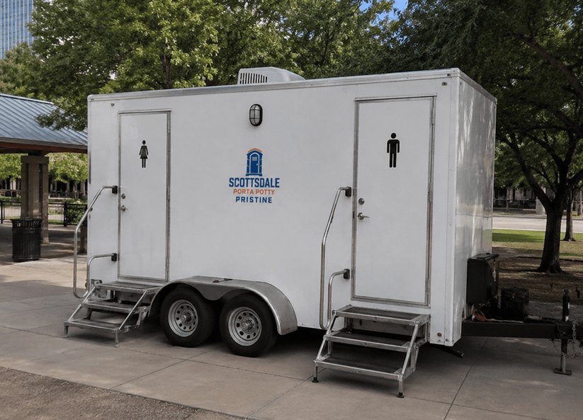 Restroom trailer rental parked at a city park event site