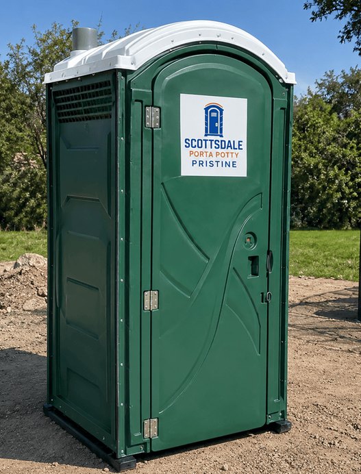 Standard green porta potty rental unit placed on a job site